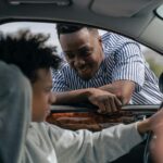 Father teaching his son how to drive, bonding and learning together.